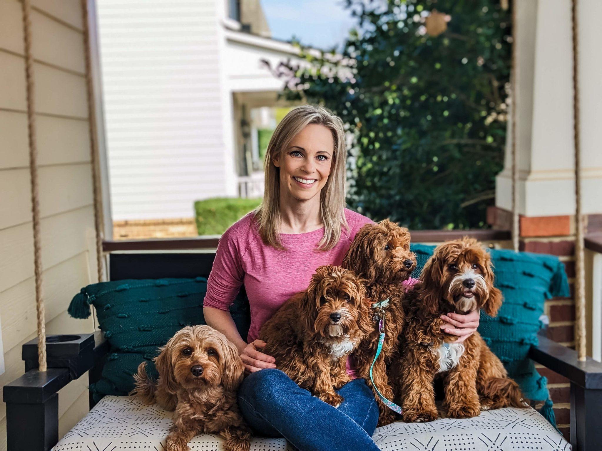 Carolina Springs with her Cavapoo dogs outdoors